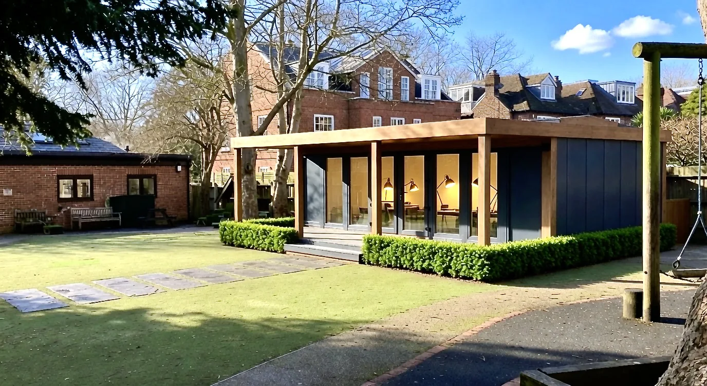 Booths garden classroom installed in a school grounds beside a playground